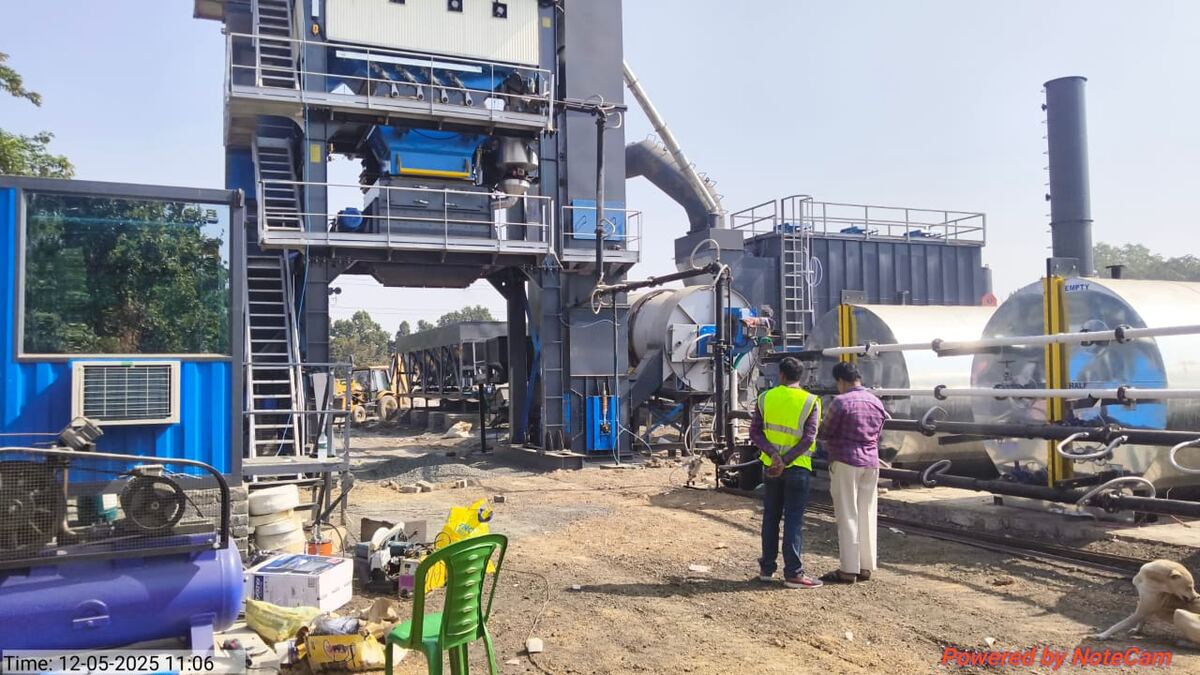 Asphalt hot mix plant with bitumen tanks and control cabin on site