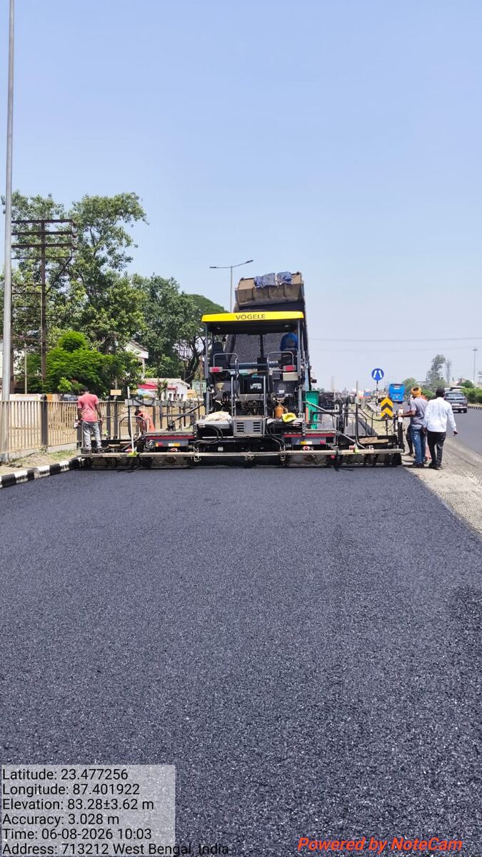 Vögele sensor-guided paver laying bituminous concrete on NH-2, West Bengal