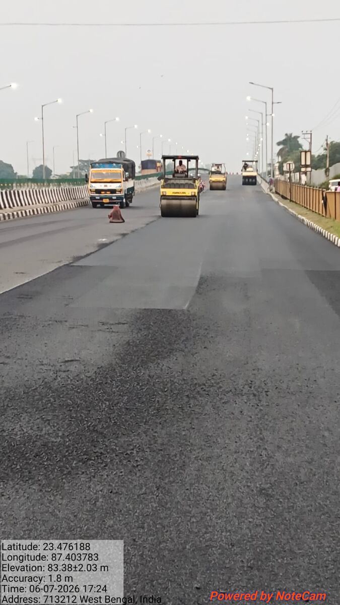 Roller train compacting a resurfaced flyover carriageway on NH-2